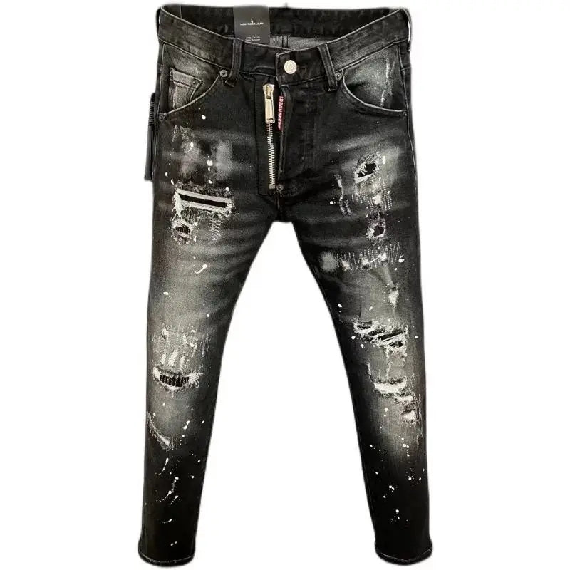 Distressed black jeans with zippers on a white background