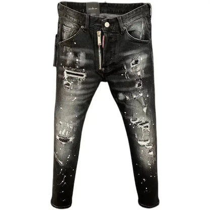 Distressed black jeans with zippers on a white background