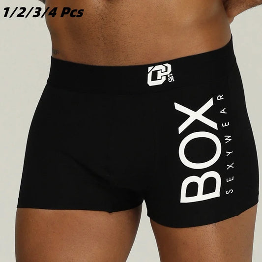 Black boxer briefs with 'BOX SEXYWEAR' branding on a plain background